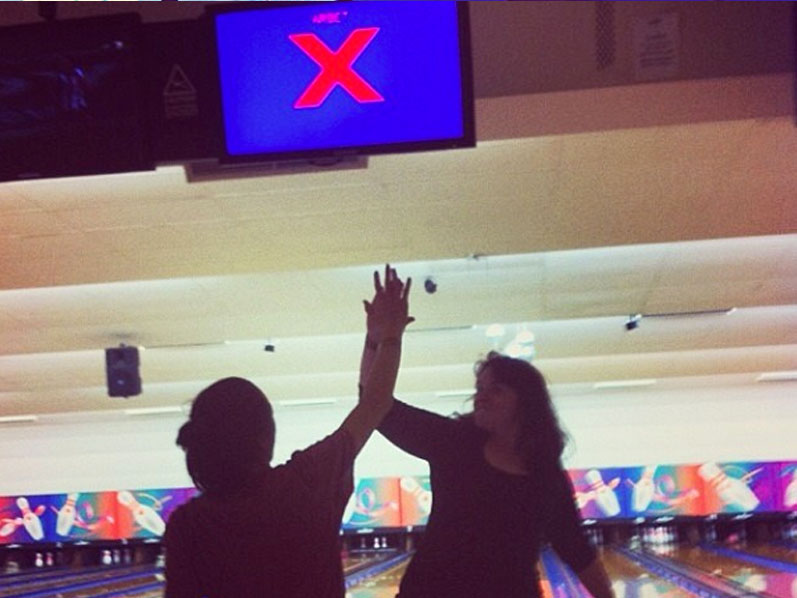 Bowling strike high five