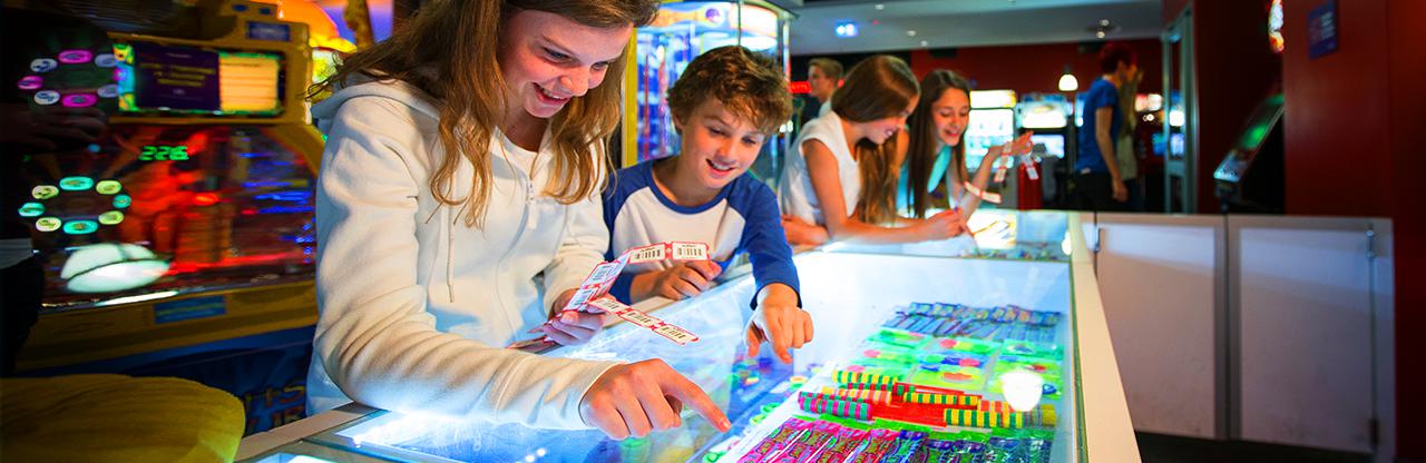 Kids checking out the arcade prizes